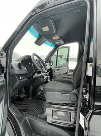 black-on-black Mercedes-Benz Sprinter van. This well-maintained vehicle offers a blend of luxury and... (image 7)