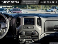 The 2026 Chevrolet Silverado 2500HD Work Truck in pristine white and equipped with a rugged 4x4 driv... (image 7)