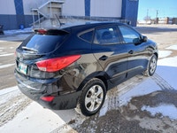 Smooth, sporty, and dependable — this 2015 Hyundai Tucson is ready for wherever the road takes you.... (image 4)