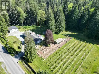 Looking for sustainability? This acreage is ideal & great for two families! Beautiful 9.67-acre hobb...