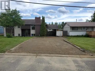 Quiet street, this larger home has lots to offer. Enclosed carport, large living room with w/b firep...