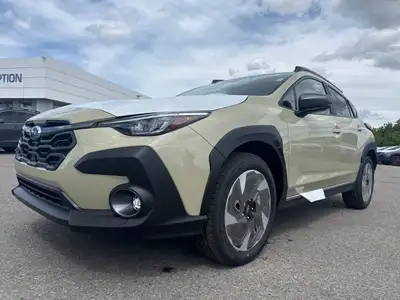 Introducing the all-new 2026 Subaru Crosstrek Limited, a tan SUV equipped with an advanced all-wheel...