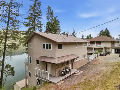 Year-round Stump Lake waterfront retreat with private dock, detached two-storey garage/workshop and...