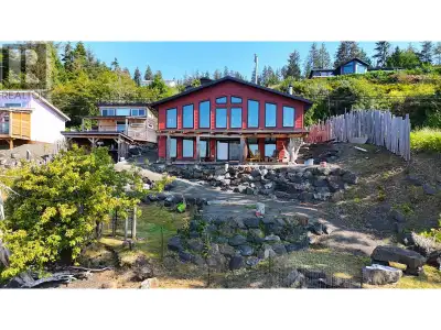 This oceanfront gem in Daajing Giids, Haida Gwaii, is a 1,800 sq. ft. custom-built 2017 home blendin...