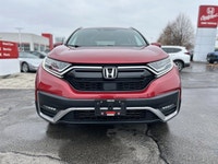 Command the road in the breathtaking Radiant Red Metallic 2021 Honda CR-V Touring, a sophisticated s... (image 1)