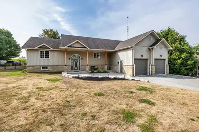 Quality Custom Built Raised Bung on .71 Acre Setting! Professionally Landscaped With Beautiful Stone...