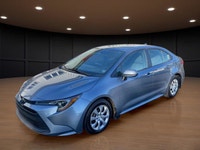 The 2023 Toyota Corolla LE in gray is a forward-thinking sedan that seamlessly marries stylish desig... (image 1)