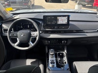 Introducing the 2026 Mitsubishi Outlander Plug-In Hybrid SE S-AWC, gliding in with a captivating sil... (image 6)