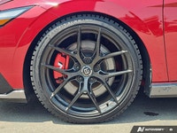 The 2025 Hyundai Elantra N, cloaked in striking Ultimate Red, delivers an adrenaline rush with its f... (image 8)