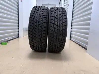 Durable Nexen winter tires come in size 215/55R17. Set includes two tires mounted on black steel rim...