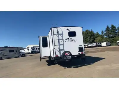EAST TO WEST Alta travel trailer 2600KRB highlights: Wardrobe/Pantry King Bed Booth Dinette Pet Dish...