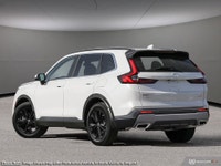 Meet the 2023 Honda CR-V Hybrid Touring, a white AWD SUV designed for exceptional handling and perfo... (image 3)