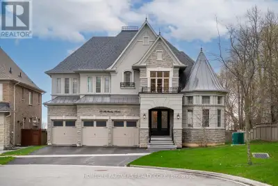 This exquisite estate is set at the end of a private cul-de-sac backing onto green space, with a 75'...
