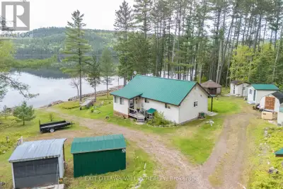 Charming Waterfront Bungalow on the Ottawa River! Set on 198 feet of pristine riverfront, this beaut...