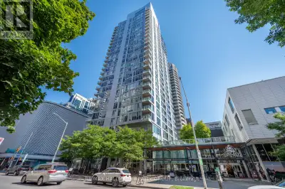 Welcome to The Surrey at Tribeca East! This beautifully maintained 1 Bedroom + Den condo offers 753...