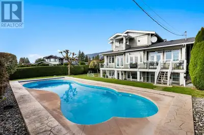 Located on a beautifully landscaped corner lot in Ambleside, this exceptional property combines luxu...