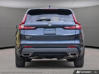 The 2026 Honda CR-V Hybrid EX-L in a stunning Blue finish with AWD handling offers an optimal drivin... (image 4)