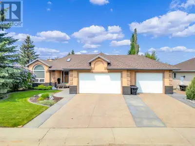 WELCOME TO THE LAKES! Lacombe's PREMIER LOCATION! This home is a SHOW STOPPER! You'll immediately no...