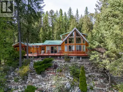 Experience Rock Haven, a year-round waterfront retreat with luxurious interiors, stunning lake views...