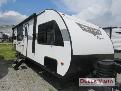 Forest River Wildwood travel trailer T24VIEW highlights: Fireplace L-Shaped Sofa Rear Kitchen Versa-...