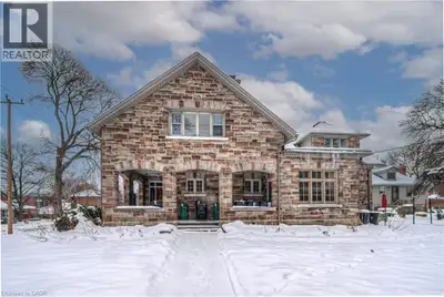 Welcome Investors to this Gorgeous Century Brick (Stove Veneer) Home! 4 units in the main building a...