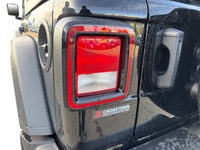 This 2025 JEEP WRANGLER 4-DOOR SPORT has the following options Cloth Low-Back Bucket Seats, Uconnect... (image 4)