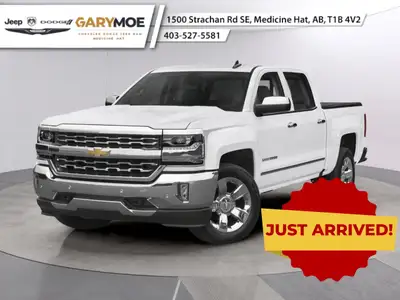 The 2018 Chevrolet Silverado 1500 LTZ in a pristine white finish offers the power of four-wheel driv...
