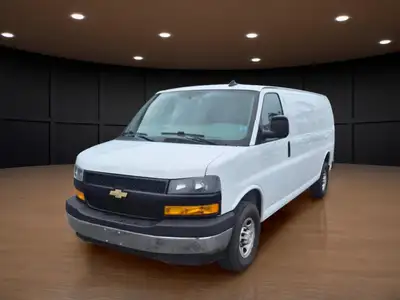 The 2020 Chevrolet Express Cargo Van 2500 Extended Wheelbase in a clean White finish, paired with re...