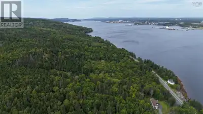 17-acre surveyed property offering privacy, natural surroundings, and water views of the Strait of C...
