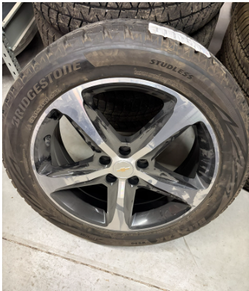 Set of 4 USED P235/50R19 Bridgestone Blizzak winter tires mounted on Alloy wheels with approx 10/32s...