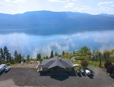 This custom-built home sits on a 1.9-acre private lot with panoramic views of Lake Okanagan. The ope...