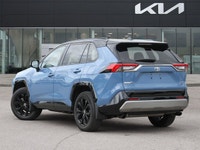 The highly anticipated 2025 Toyota RAV4 Hybrid XSE, a striking light blue Sport Utility with a sophi... (image 3)