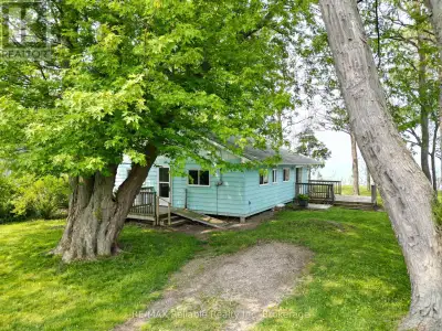 Discover the peaceful charm of lakefront living at this inviting 3-bedroom, 1-bath cottage located j...