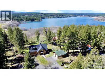 Magnificent log home on 1.88 acres with a gorgeous view overlooking 108 Mile Lake in southwesterly d...