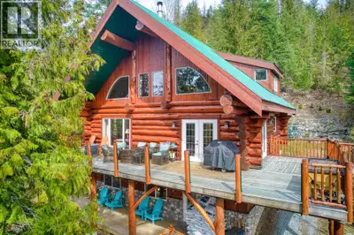 Grand Log Home Masterpiece at Mabel Lake. A true work of art, this custom hand-crafted log home is s...