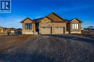 To Be Built - This 3-bedroom, 2-bath semi-detached bungalow in Delhi offers a modern open-concept la...