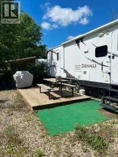 Lot is adjacent t o golf course and has a 2013 Denali Dutchmen trailer which when purchased went str...