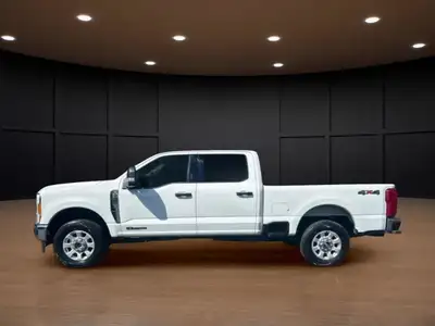 The 2023 Ford Super Duty F-250 SRW XLT in striking white comes equipped with a robust 4x4 drivetrain...