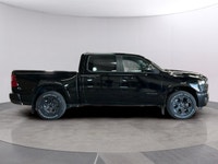 The 2026 Ram 1500 Big Horn 4x4 Crew Cab in a striking black exterior combines rugged durability with... (image 5)