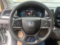 A spacious family minivan with comfortable seating, advanced safety features, and practical convenie... (image 9)