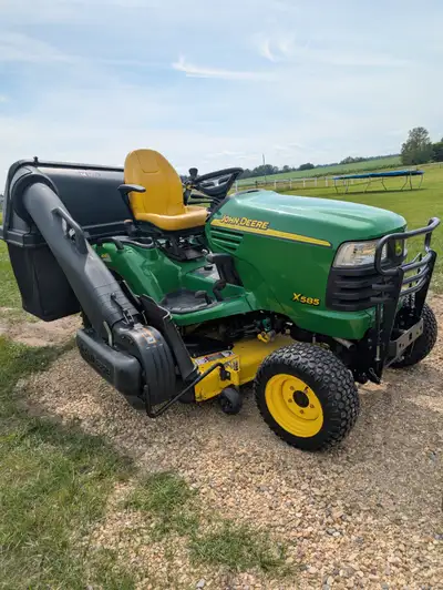 John Deere X585 with 4x4 and 54" mowing deck, bagger system, View more