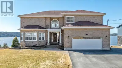 Stunning Hilltop Home with access and Panoramic Views of the Saint John River Perched atop a scenic...