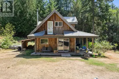Welcome to your homesteading paradise. This well-built house, with a flowing and cozy layout, is nes...