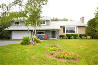 This beautiful Fleming Heights 4-level side-split home is situated on the largest lot on desirable S...