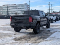 The 2026 Ram 1500 RHO Crew Cab in Diamond Black Crystal Pearl delivers bold styling and high-perform... (image 6)