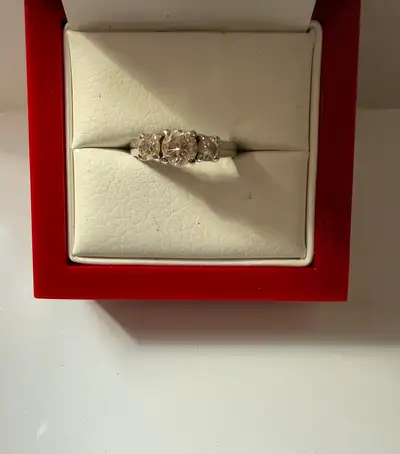 We are selling a Women's14K White gold engagement ring with 3 diamonds. ♦Size 6.5/3.9 grams ♦Total d...