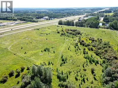 Exceptional opportunity to own high-visibility commercial land less than 2 km west of Edson with dir...