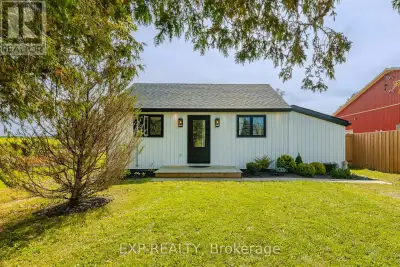 Nestled on a generous.35 acre lot, this beautifully updated bungalow blends country-like surrounding...