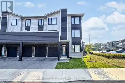 Spacious 3-bedroom, 2.5-bath end-unit townhome with a double car garage for rent in North London, lo...