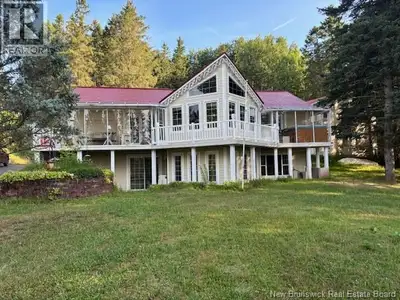 This custom built chalet has so much to offer all tucked into the trees sitting on a one acre lot on...